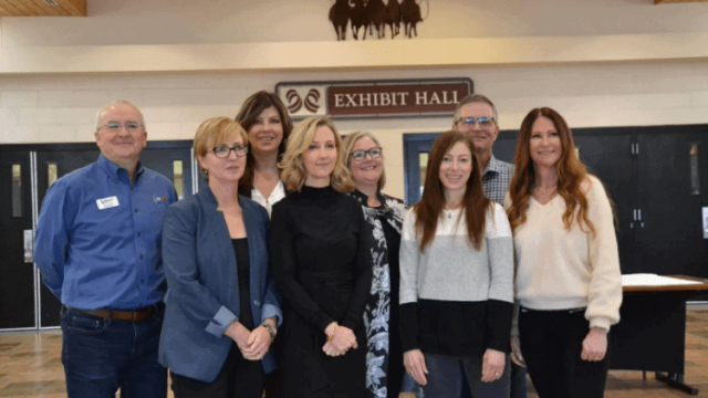 Group shot of Project Unite managers in the Exhibit Hall include, from left, Mo Canady, Susan Payne, Dr. Sarah Goodrum, Michele Gay, Donna Lefebvre, Dr. C.J. Huff, Dr. Beverly Kingston, and Carly Posey.